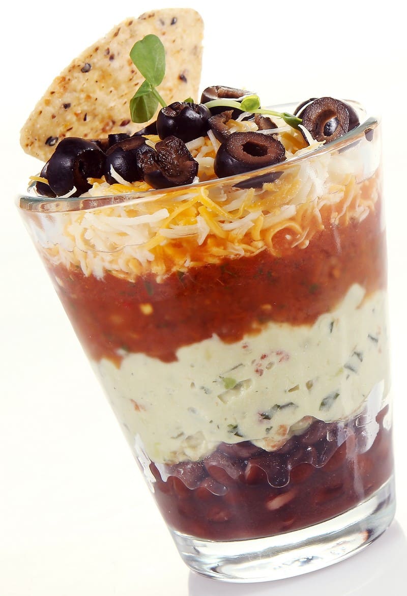Fresh 5 Layer Mexican Dip in Glass Tumbler Food Picture