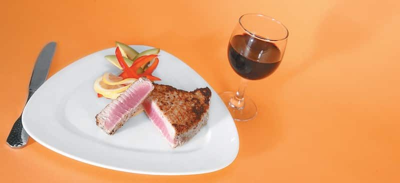 Ahi Tuna on a Plate with a Glass of Wine Food Picture
