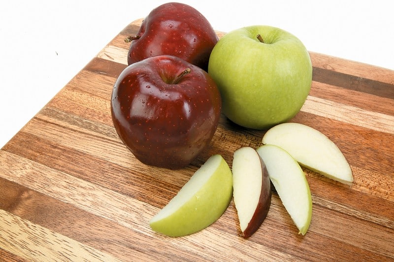 Whole and Sliced Assorted Apples on Board Isolated Food Picture