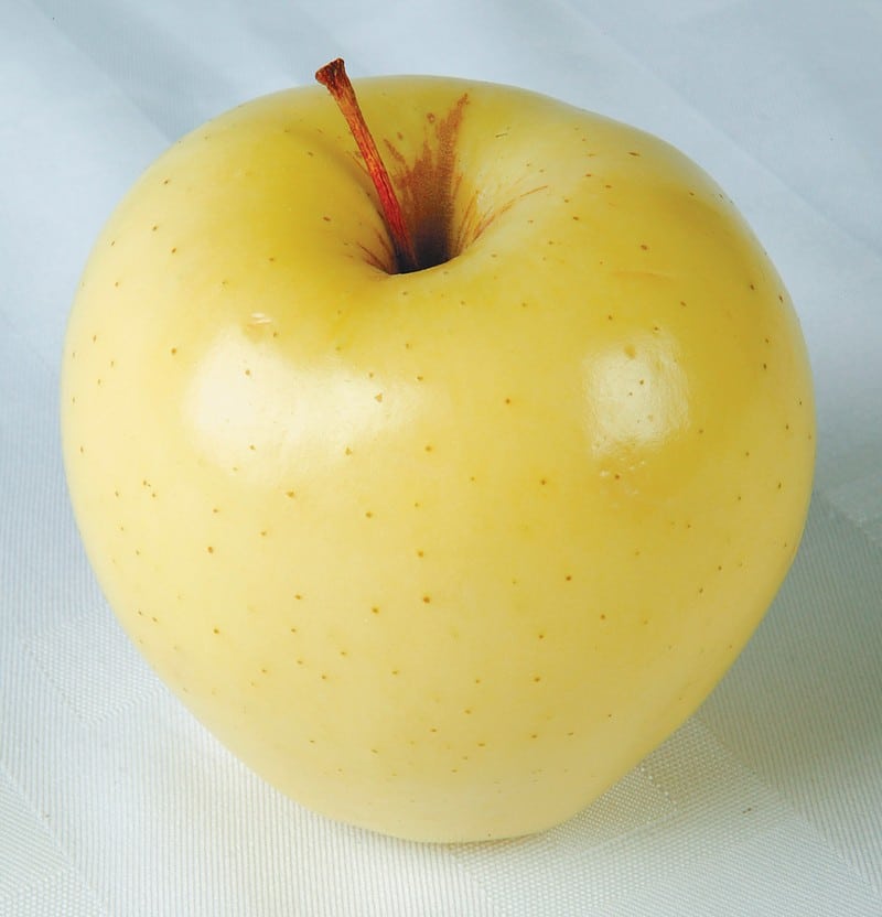 Golden Delicious Apple on White Surface Food Picture