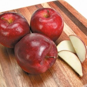 Whole and Sliced Red Delicious Apples on Board Isolated Food Picture
