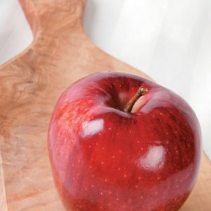 Red Delicious Apple on Board on White Surface Food Picture