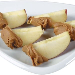 Apple Slices on a Plate Dipped in Peanut Butter Food Picture