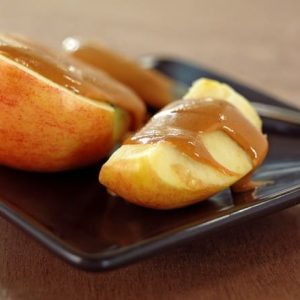 Apple Slices Topped with Creamy Peanut Butter Food Picture