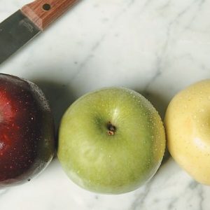 Assorted Apple on Marble Top with a Knife Food Picture