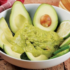 Avocados, Lime, and Guacamole in White Bowl Food Picture