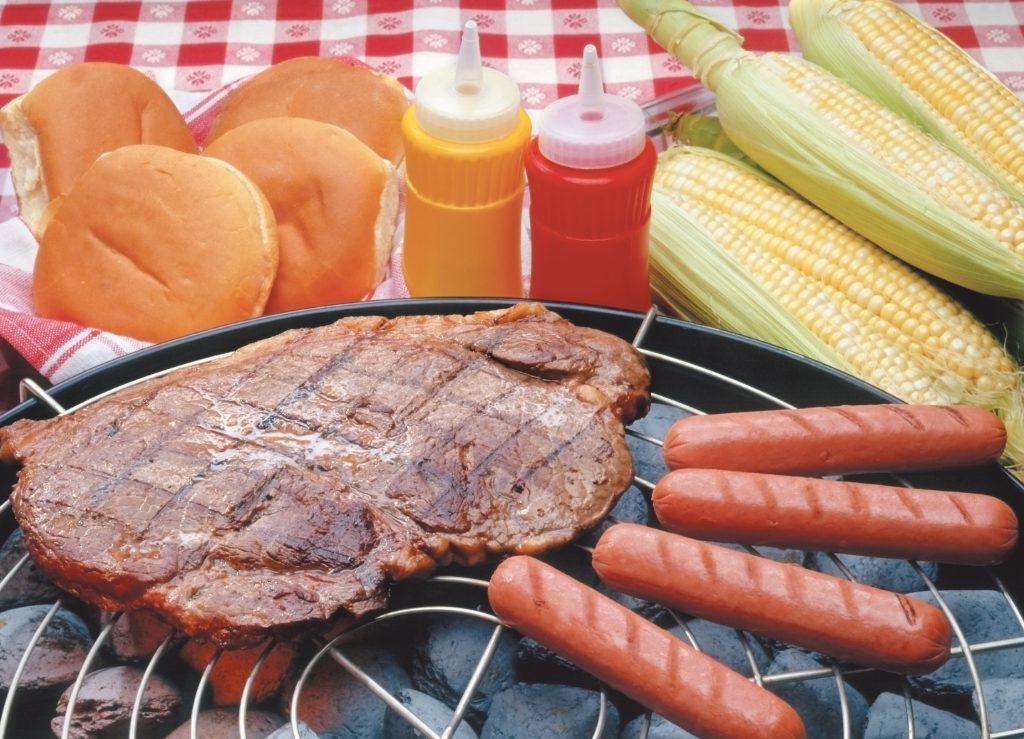 Summertime Grilling with Steak and Hot Dogs and Corn on The Cob Food Picture