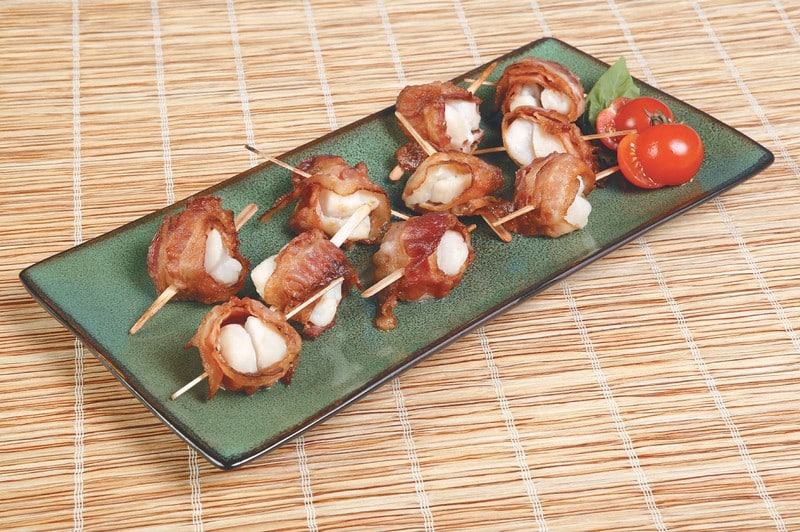 Bacon Wrapped Scallops on Dish with Baby Tomatoes Food Picture