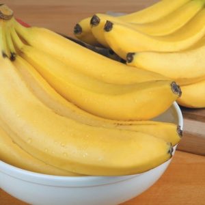 Bananas on a Board and in a Bowl Food Picture
