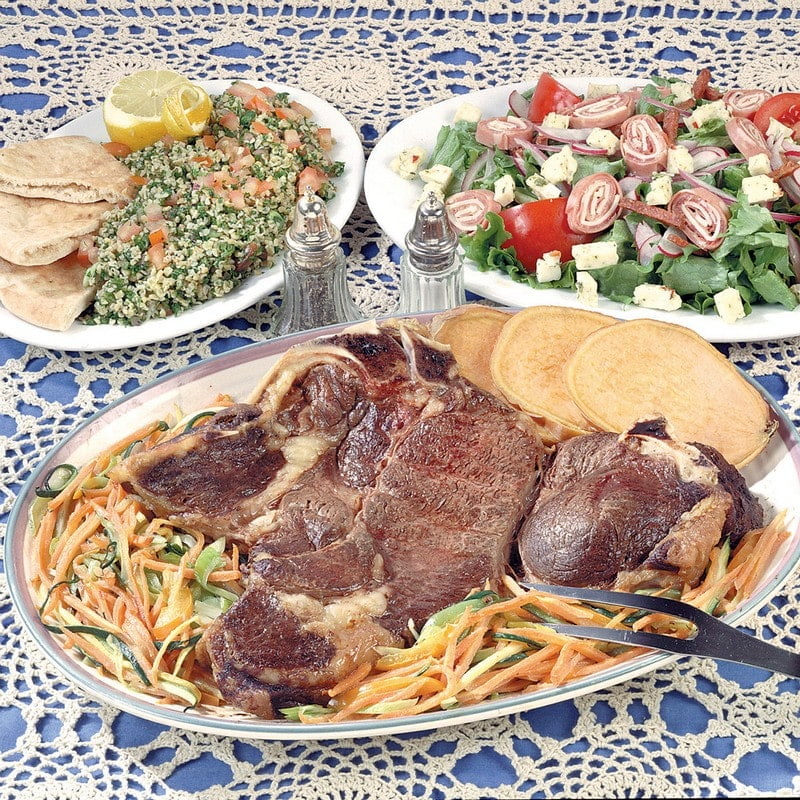 Fresh Cooked Bone-In Chuck Steak over Pasta with Salads Food Picture