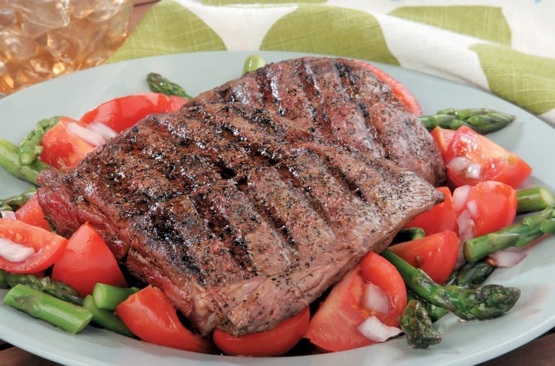 Beef Flat Iron Steak on Asparagus and Tomatoes Food Picture