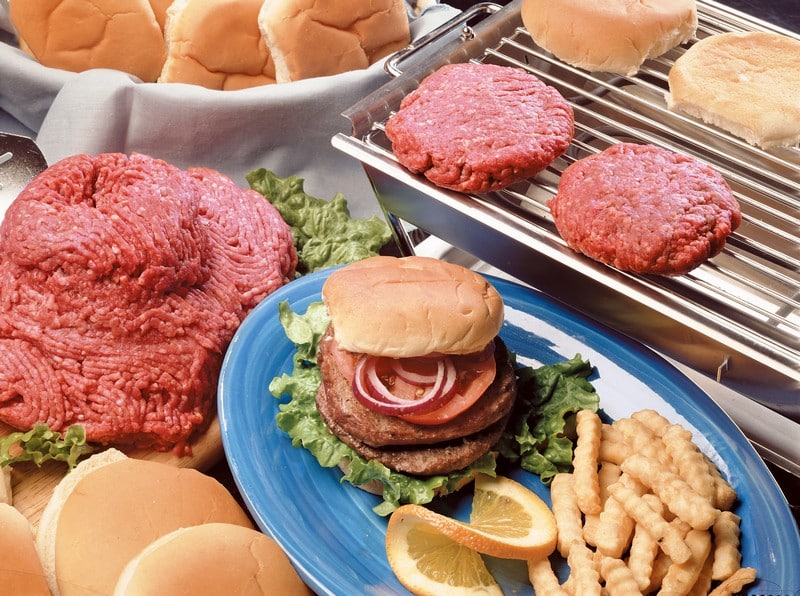 Cooked and Raw Hamburgers on Table and Grill Food Picture