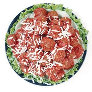 Plate of Beef Meatballs over Lettuce with Shredded Parm Food Picture