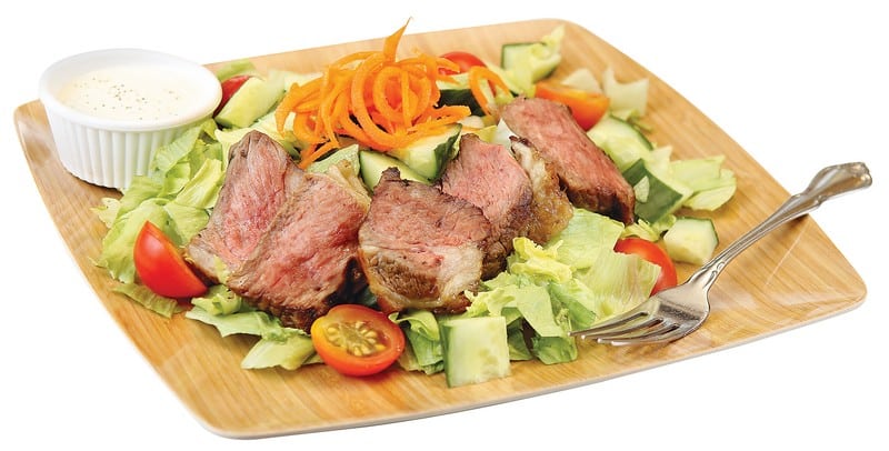 Cooked Beef New York Strip Steak over Chopped Salad Food Picture