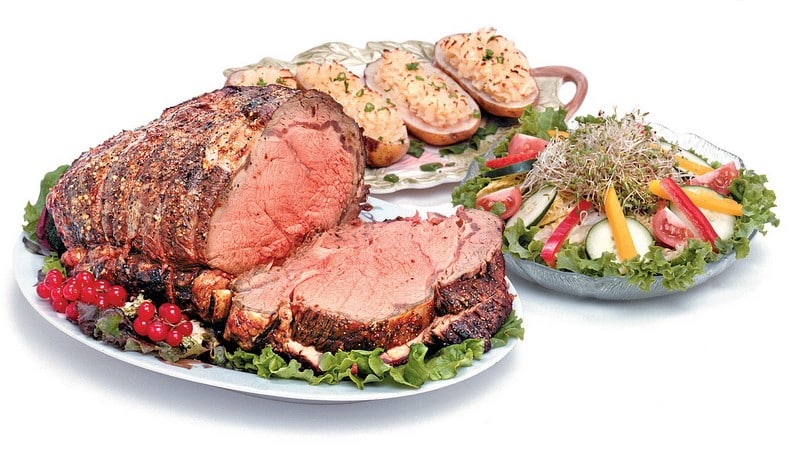 Cooked Beef Prime Rib Roast with Sides and Salad Food Picture