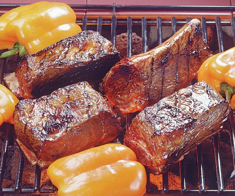 Fresh Beef Ribs Cooking on Grill with Peppers Food Picture