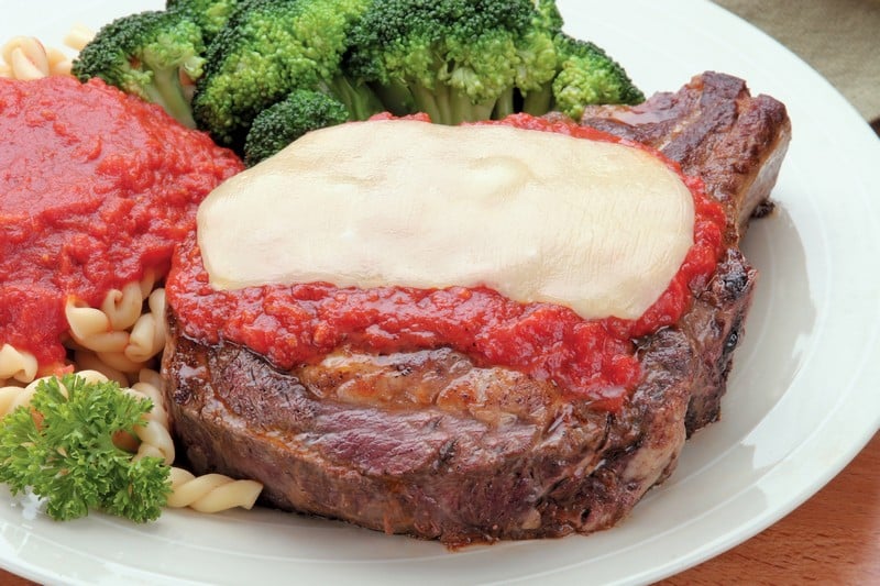 Cooked Bone-In Beef Rib Eye Steak with Pasta and Sauce Food Picture