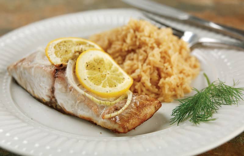 Bluefish Fillet on White Ridged Plate with Garnish Food Picture
