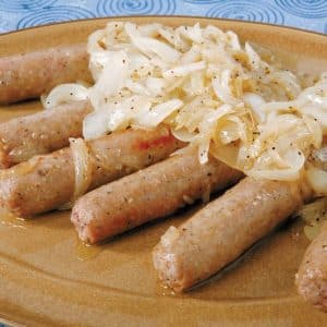 Bratwurst with Grilled Onions on Brown Plate Food Picture