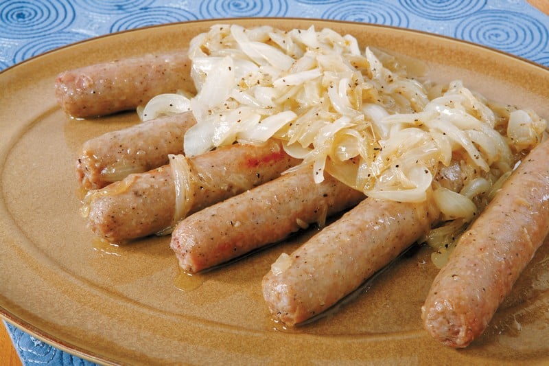 Bratwurst with Grilled Onions on Brown Plate Food Picture
