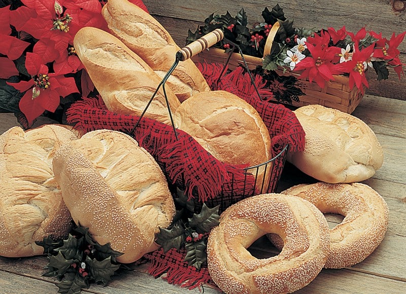 Bread Assortment with Red Accents on Wooden Surface Food Picture