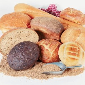 Assorted Whole Bread Loaves on Table Food Picture
