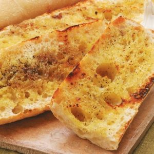 Crispy Grilled Garlic Bread on Cutting Board Food Picture