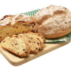 Sliced & Whole Irish Soda Bread on Cutting Board Food Picture