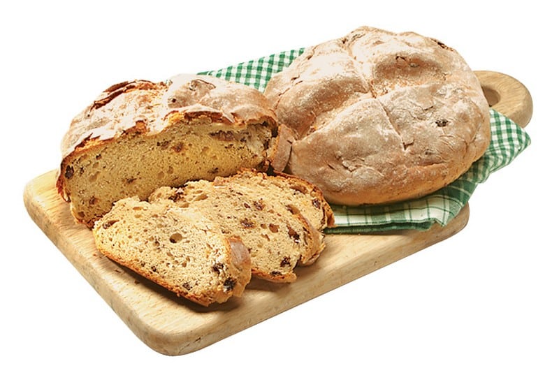 Sliced & Whole Irish Soda Bread on Cutting Board Food Picture