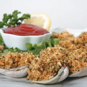 Breaded Calm Shells on a Plate with Sauce and a Lemon Slice Food Picture