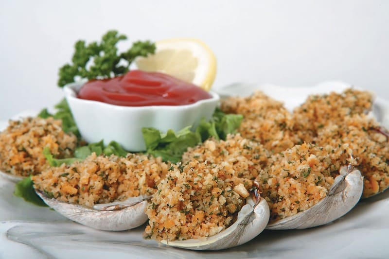 Breaded Calm Shells on a Plate with Sauce and a Lemon Slice Food Picture