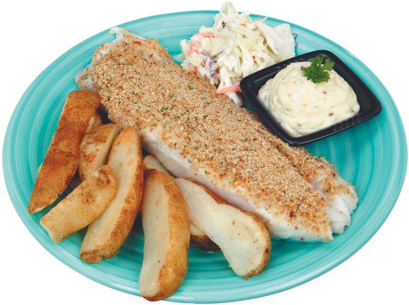 Breaded Cod and Potato Wedges on a Plate with Sauce and Coleslaw Food Picture