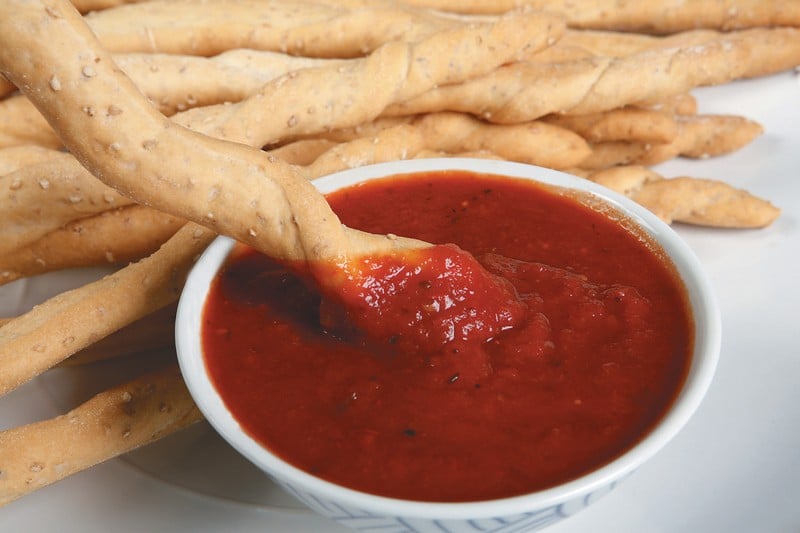 Breadsticks Dipped in Sauce Food Picture