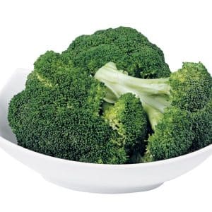 Broccoli crowns in a white bowl with a white background Food Picture