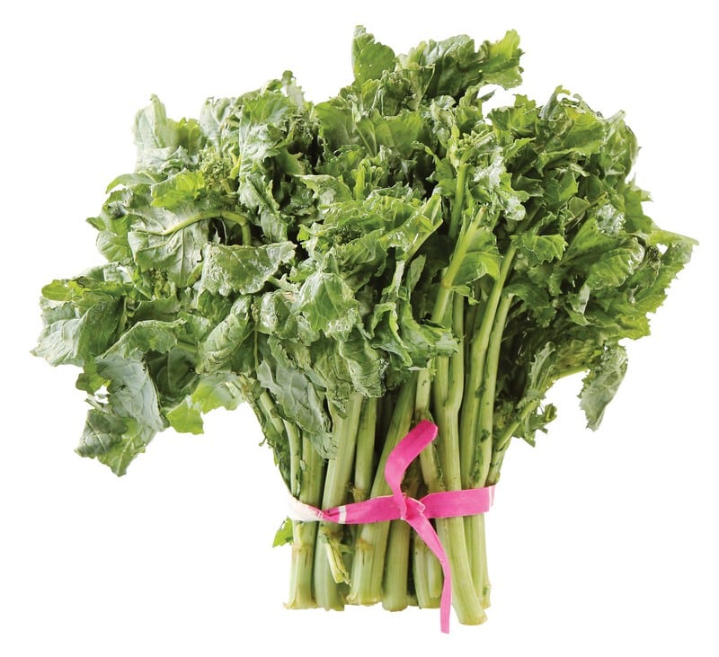 Broccoli rabe tied with pink ribbon on white background Food Picture