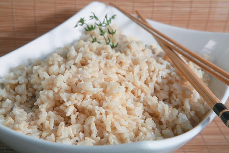 Brown Rice in a Bowl with Chop Sticks Food Picture