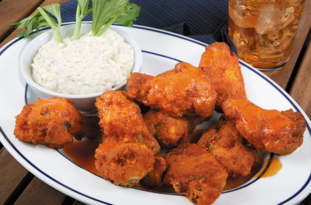 Buffalo Wings on White Plate with Blue Trim Food Picture