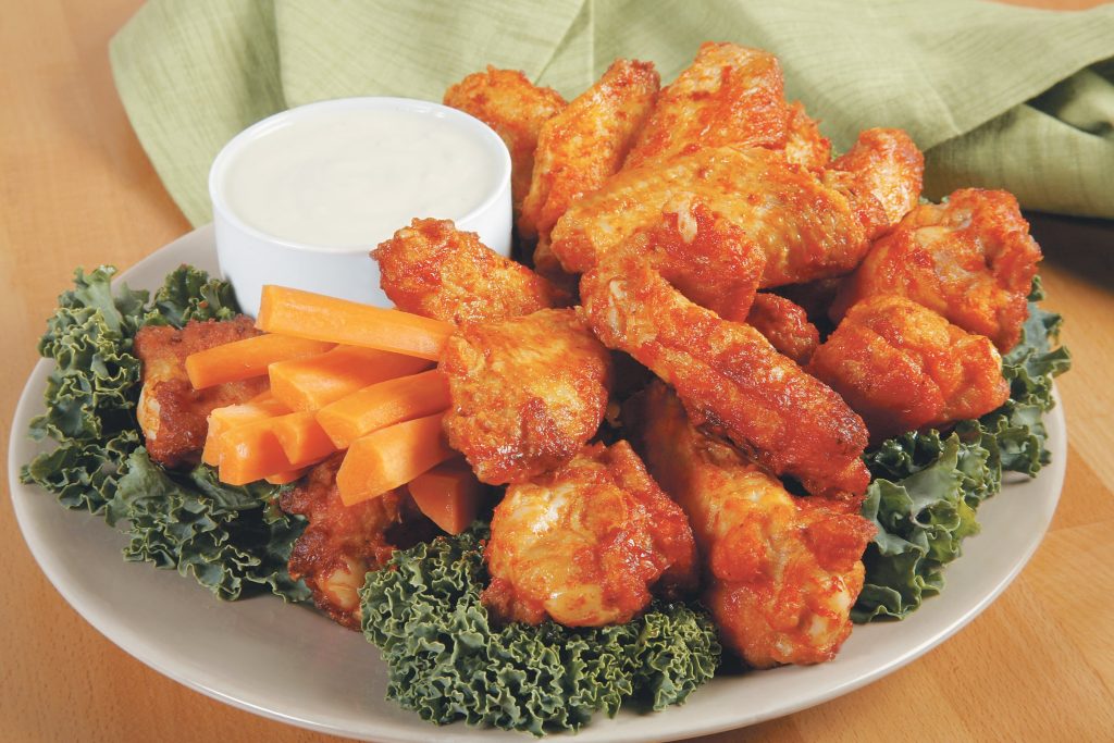 Buffalo Wings with Kale Garnish Food Picture