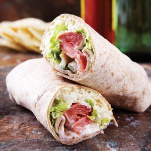 Lettuce, Tomato, Cheese, and Sour Cream Burrito on Brown Surface Food Picture