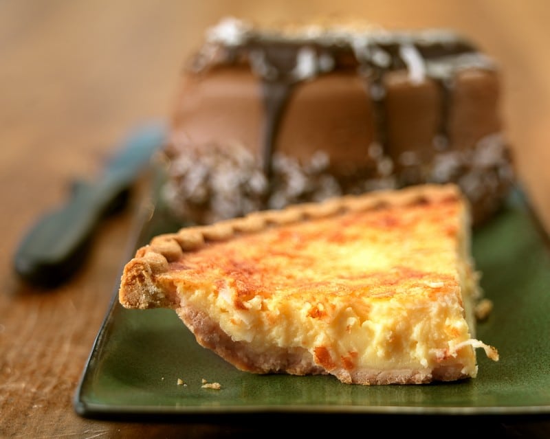 Whole Chocolate Fudge Cake and Slice of Custard Pie Food Picture