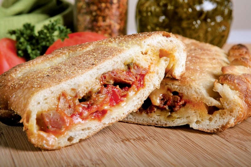 Steak & Cheese Calzone on Cutting Board Food Picture