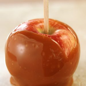 Sweet Whole Caramel Apple on a Stick Food Picture