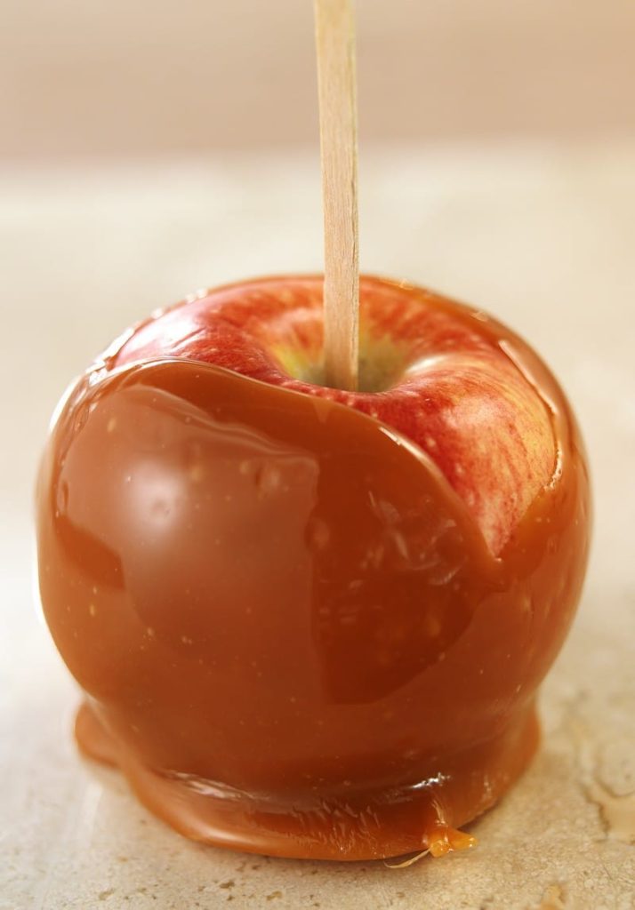 Sweet Whole Caramel Apple on a Stick Food Picture