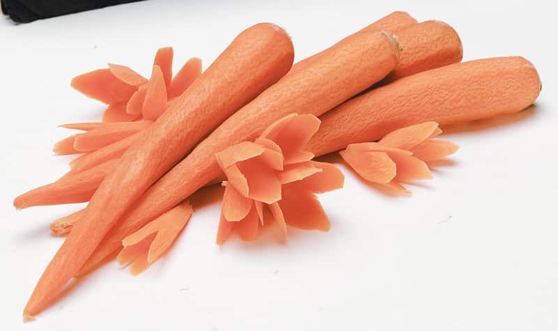 Peeled Carrots on White Surface Food Picture