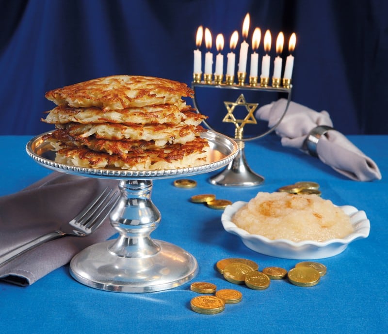 Fresh Chanukah Potatoes with Applesauce and Lit Candles Food Picture