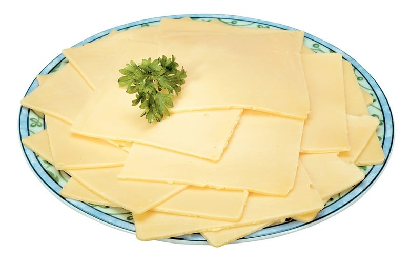 Yellow Sliced American Cheese with Garnish on Decorative Plate Food Picture