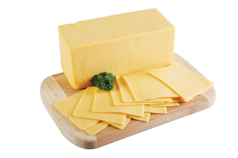 Yellow American Cheese with Garnish on Wooden Board Food Picture