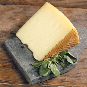 Menchego Cheese with Sage on Rock Slab Food Picture