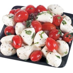 Mozzarella Cheese Balls with Cherry Tomatoes and Basil on Black Plate Food Picture