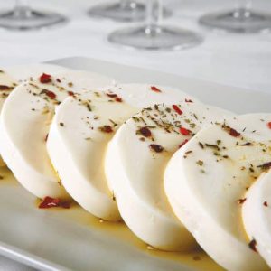 Mozzarella Cheese with Seasoning and Oil on White Plate Food Picture